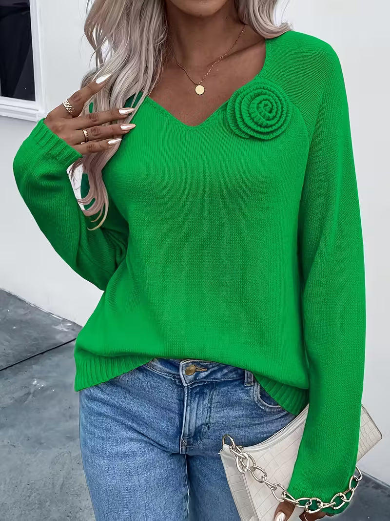 Maglione primaverile con dettaglio floreale